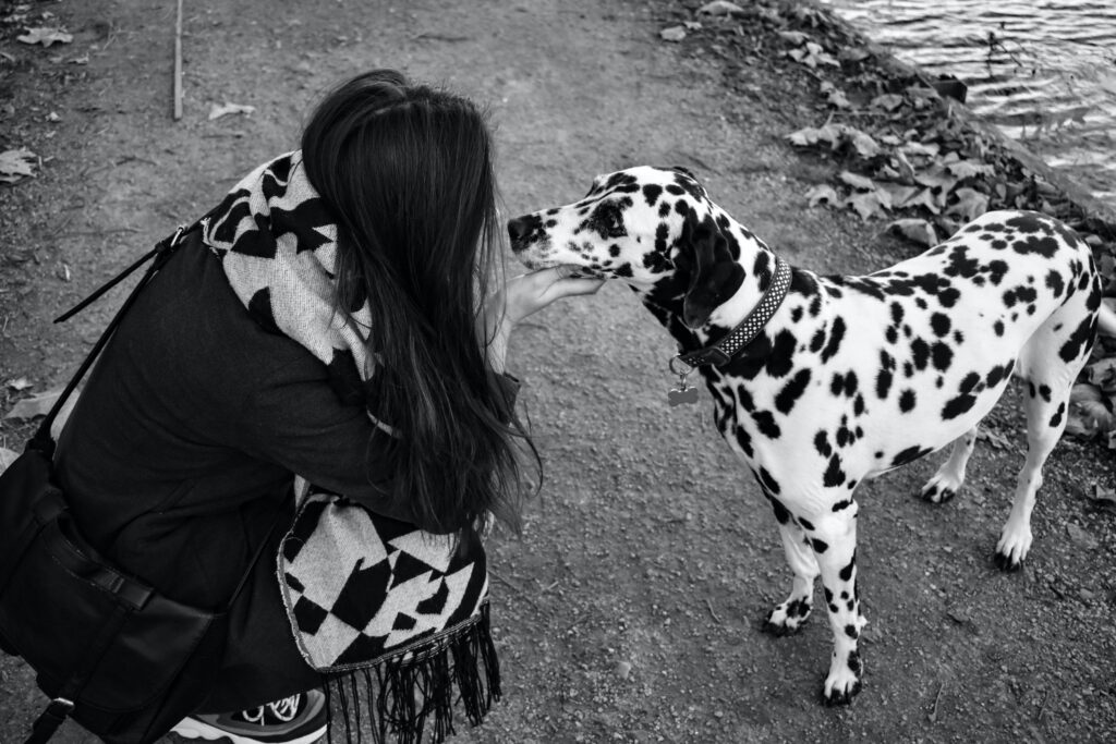 Girl showing affection to her dog